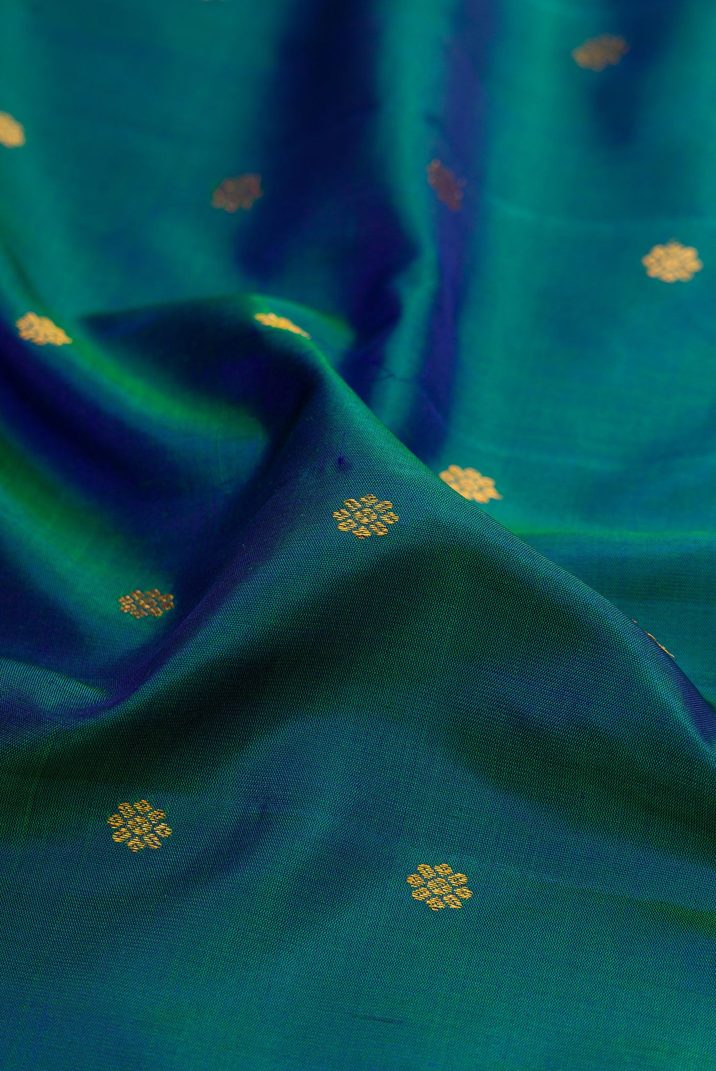 Close up of Electric Blue Dual Tone Gadwal Silk Saree with Zari Butta on the body and Zari Border.  displaying folds