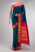 Electric Blue Dual Tone Gadwal Silk Saree with Zari Butta on the body and Zari Border.  displayed on a mannequin
