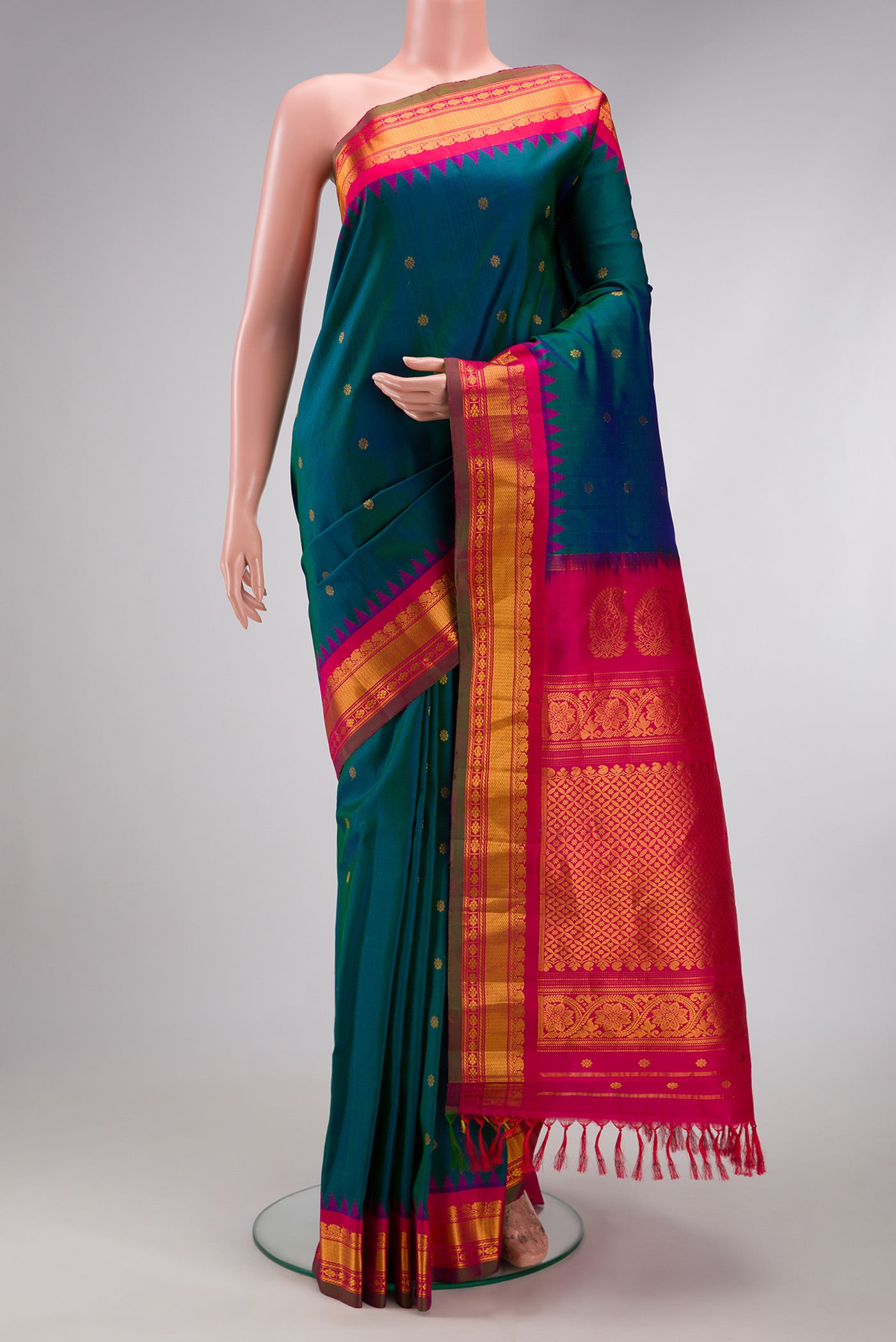 Electric Blue Dual Tone Gadwal Silk Saree with Zari Butta on the body and Zari Border.  displayed on a mannequin