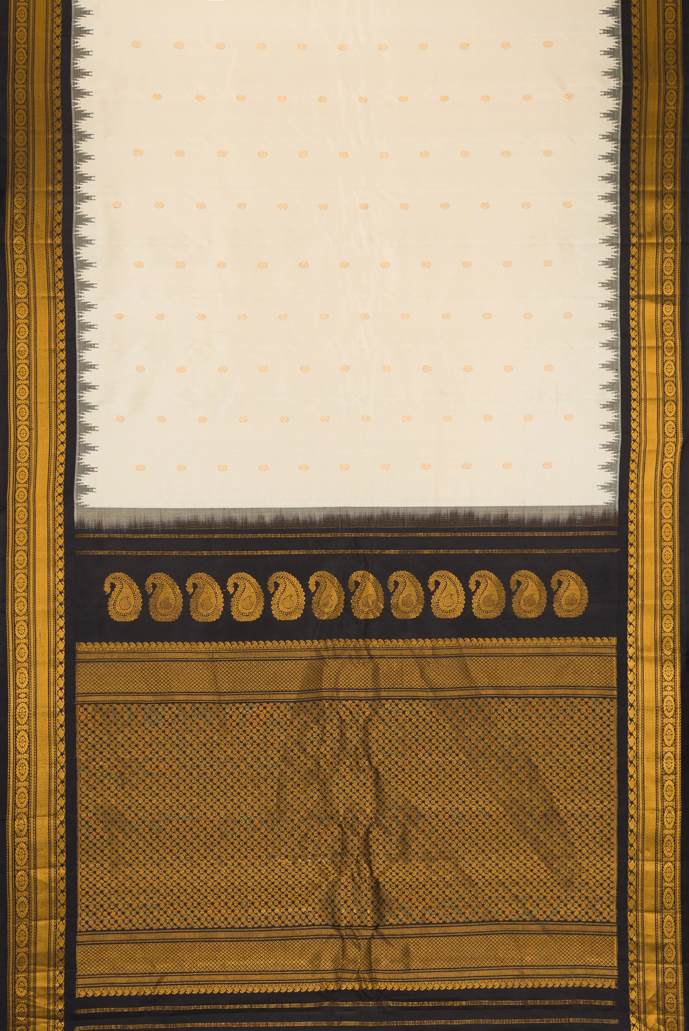 Flat view of Off White Gadwal Silk Saree with Zari Butta on the body and Temple Border. 