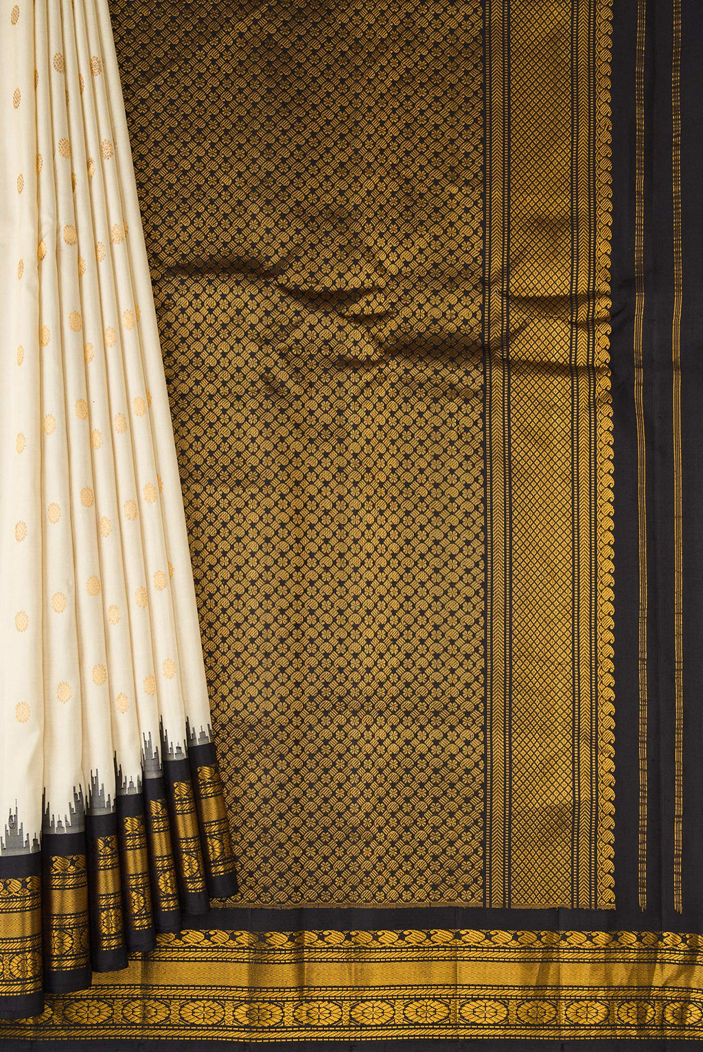 Pleats and pallu of Off White Gadwal Silk Saree with Zari Butta on the body and Temple Border. 