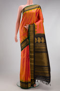 Pinkish Yellow Dual Tone Gadwal Silk Saree with Zari Butta on the body and Fancy Border.  displayed on a mannequin