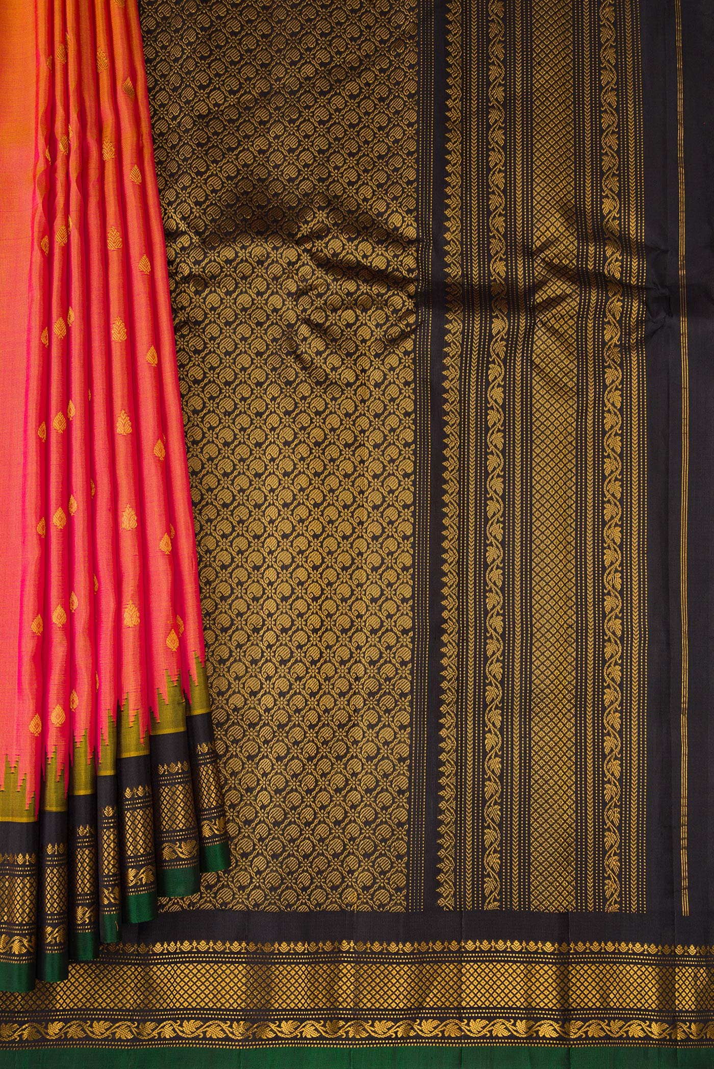 Pleats and pallu of Pinkish Yellow Dual Tone Gadwal Silk Saree with Zari Butta on the body and Fancy Border. 