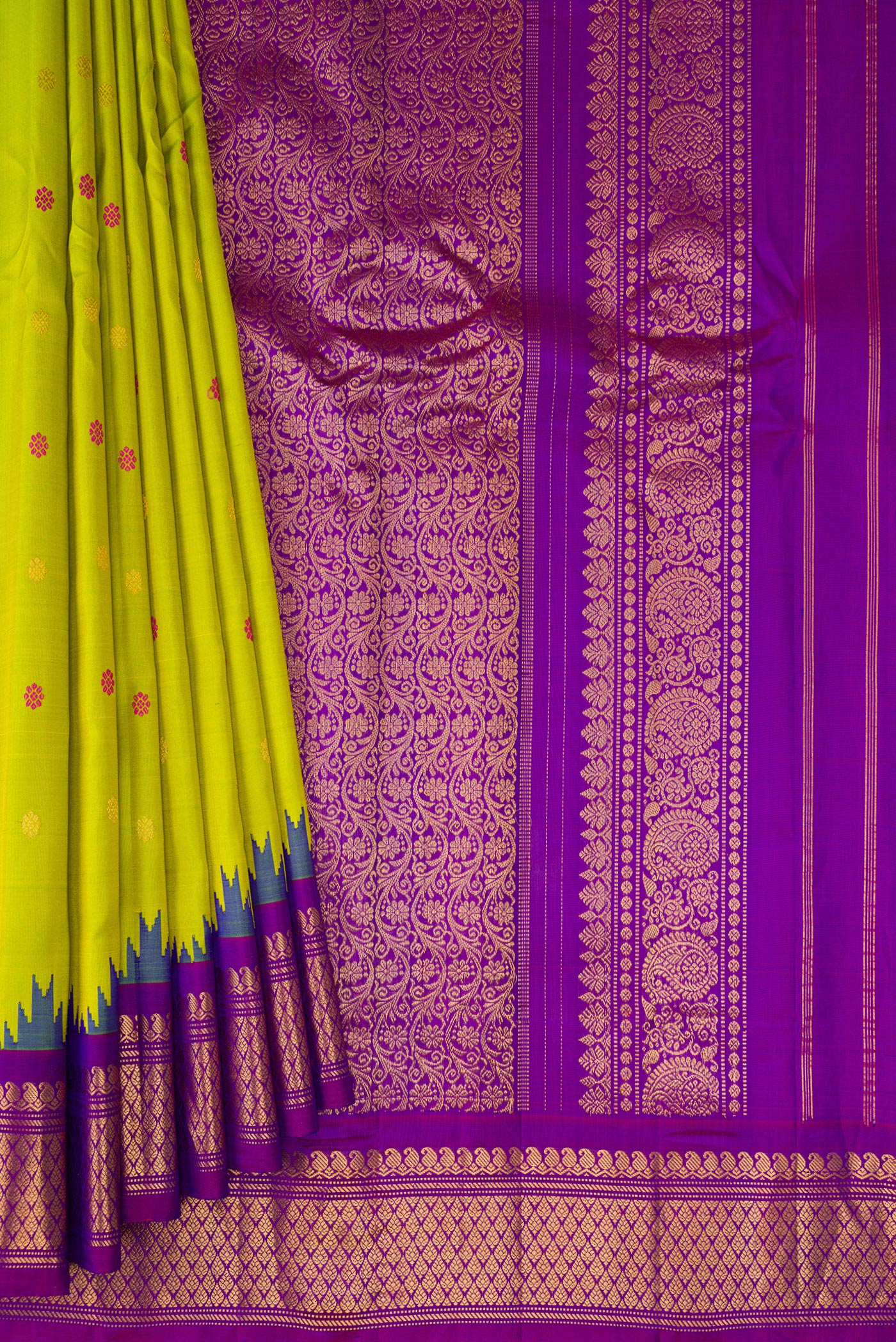 Pleats and pallu of Parrot Green Gadwal Silk Saree with Zari And Thread Butta on the body and Temple Border. 