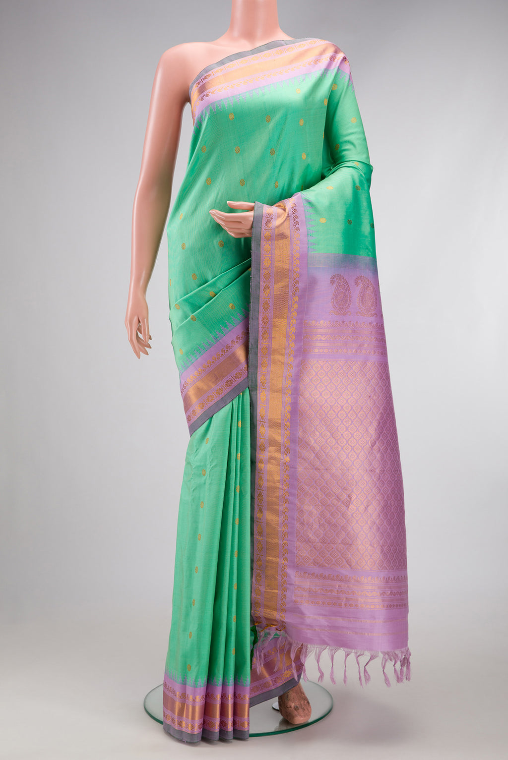Sea Green Gadwal Silk Saree with Zari Butta on the body and Zari Border.  displayed on a mannequin