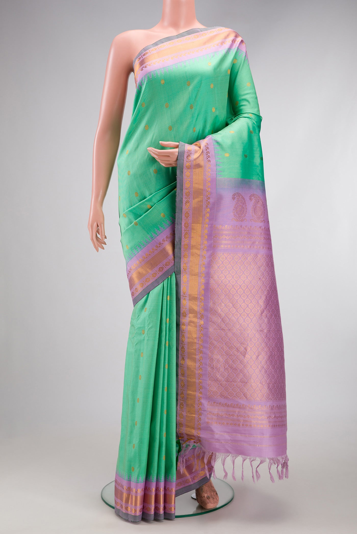 Sea Green Gadwal Silk Saree with Zari Butta on the body and Zari Border.  displayed on a mannequin