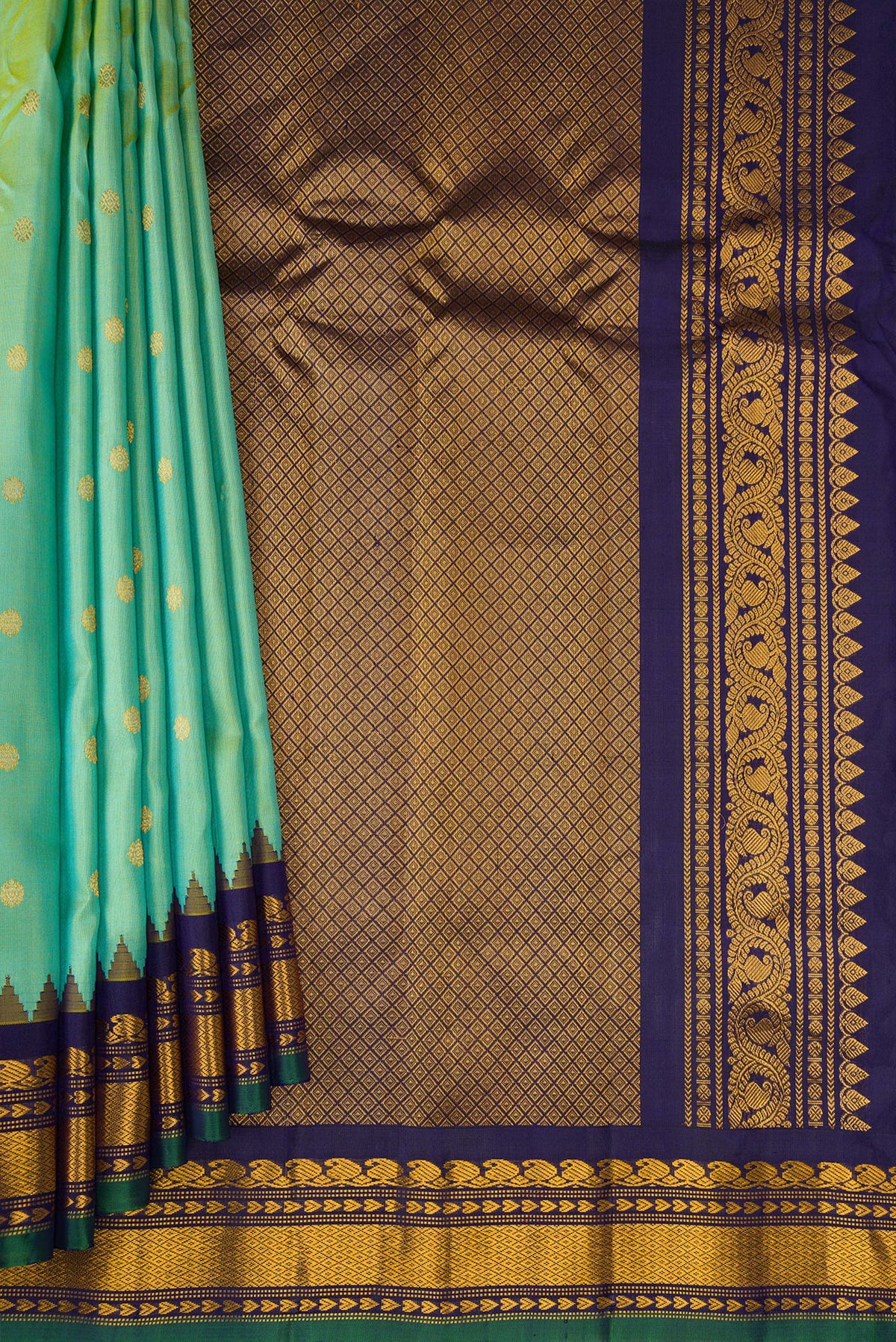 Pleats and pallu of Pista Green Gadwal Silk Saree with Zari Butta on the body and Temple Border. 