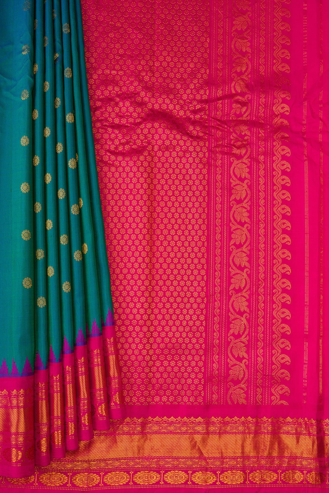 Pleats and pallu of Peacock Blue Gadwal Silk Saree with Zari Butta on the body and Zari Border. 