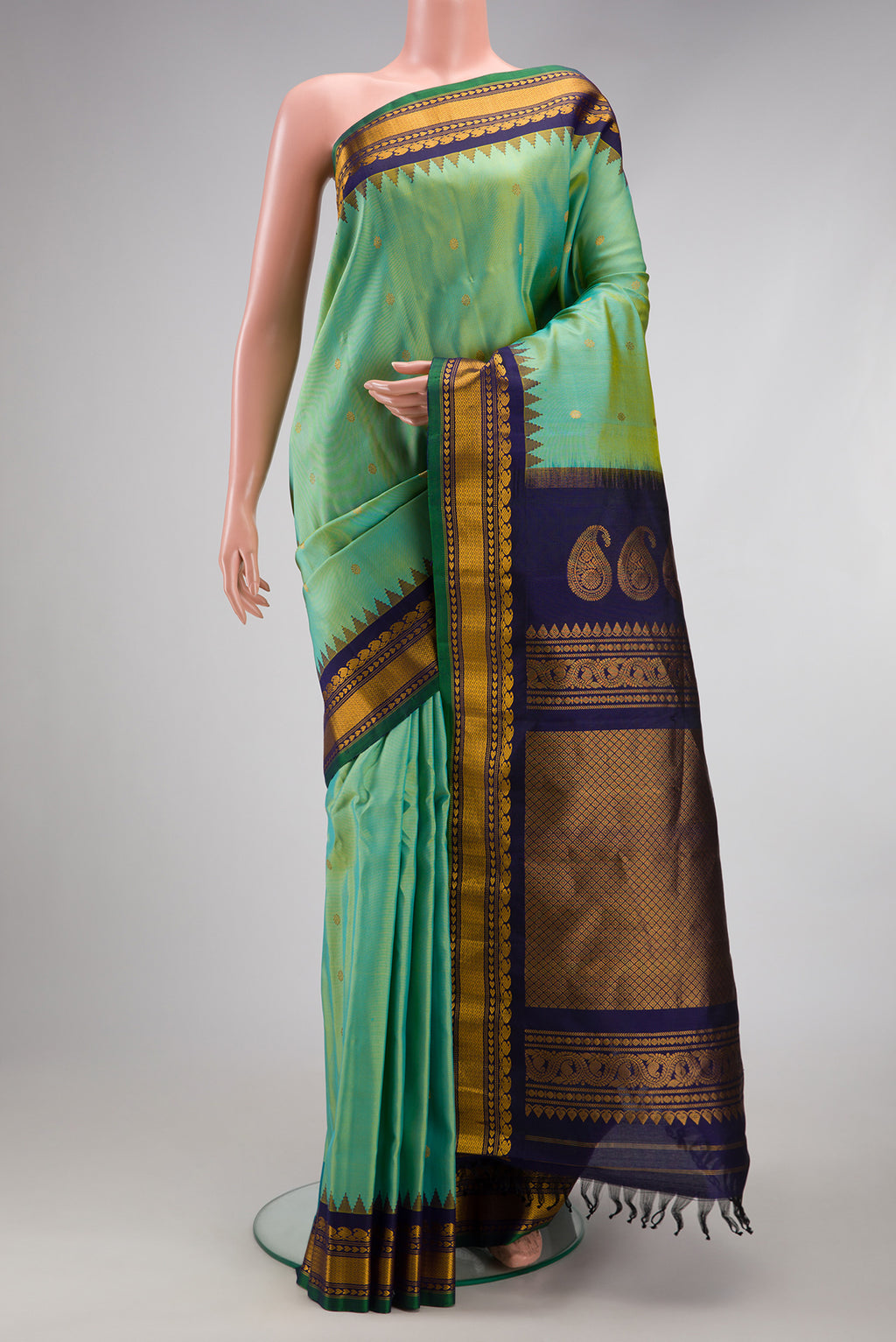 Light Green Dual Tone Gadwal Silk Saree with Zari Butta on the body and Zari Border.  displayed on a mannequin