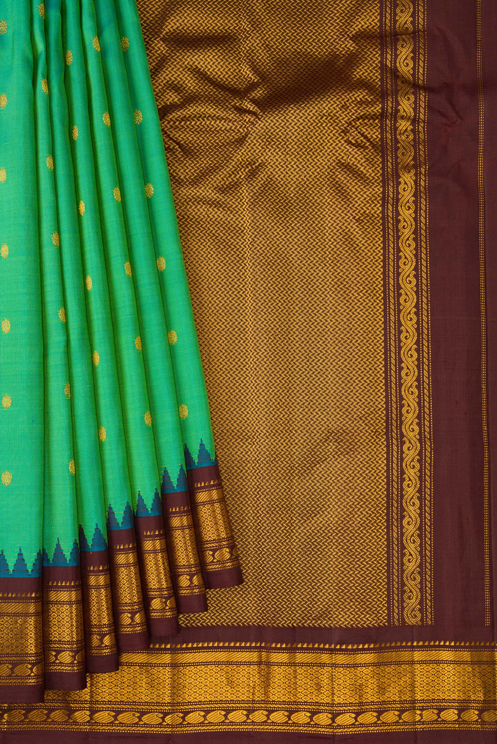 Pleats and pallu of Sea Green Gadwal Silk Saree with Zari Butta on the body and Zari Border. 