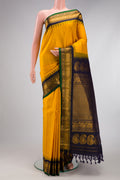 Yellow Gadwal Silk Saree with Zari Butta on the body and Zari Border.  displayed on a mannequin