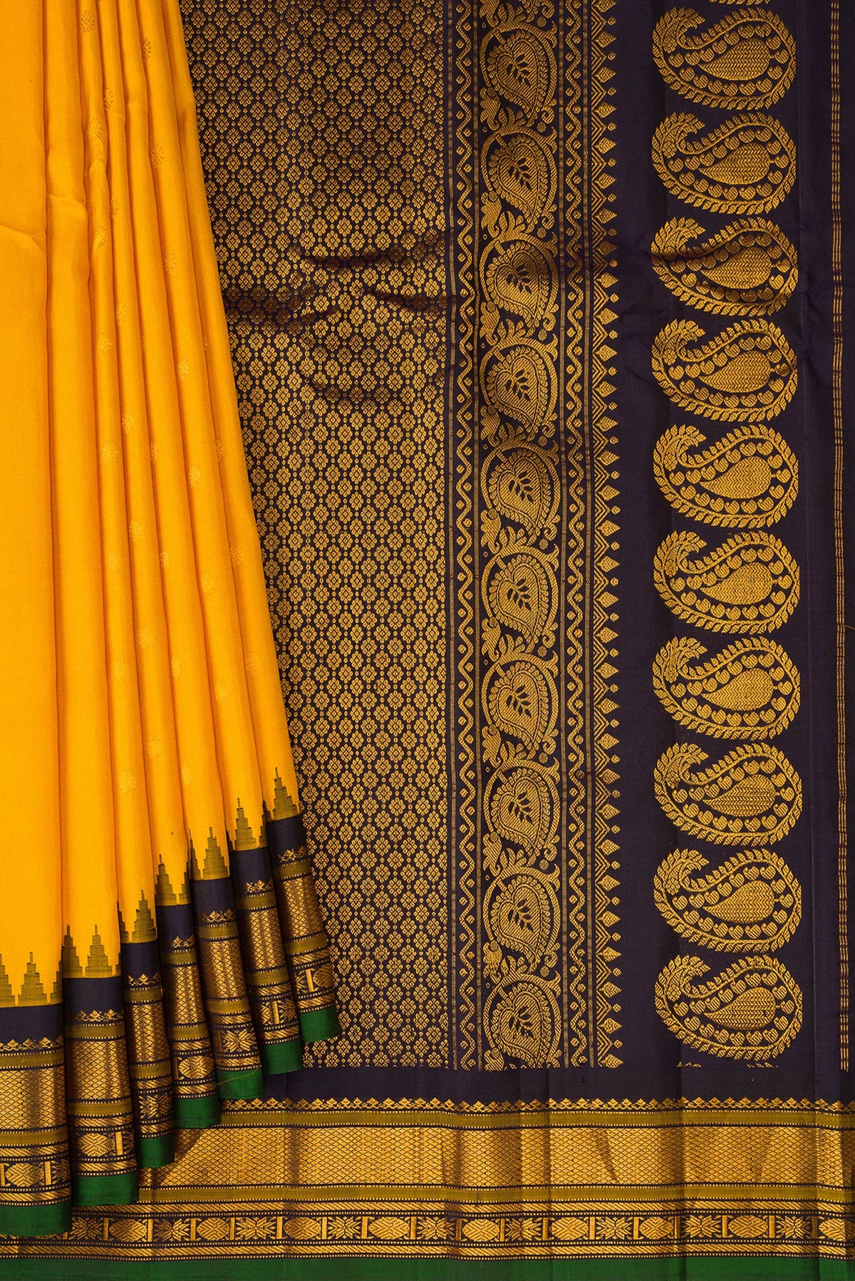 Pleats and pallu of Yellow Gadwal Silk Saree with Zari Butta on the body and Zari Border. 
