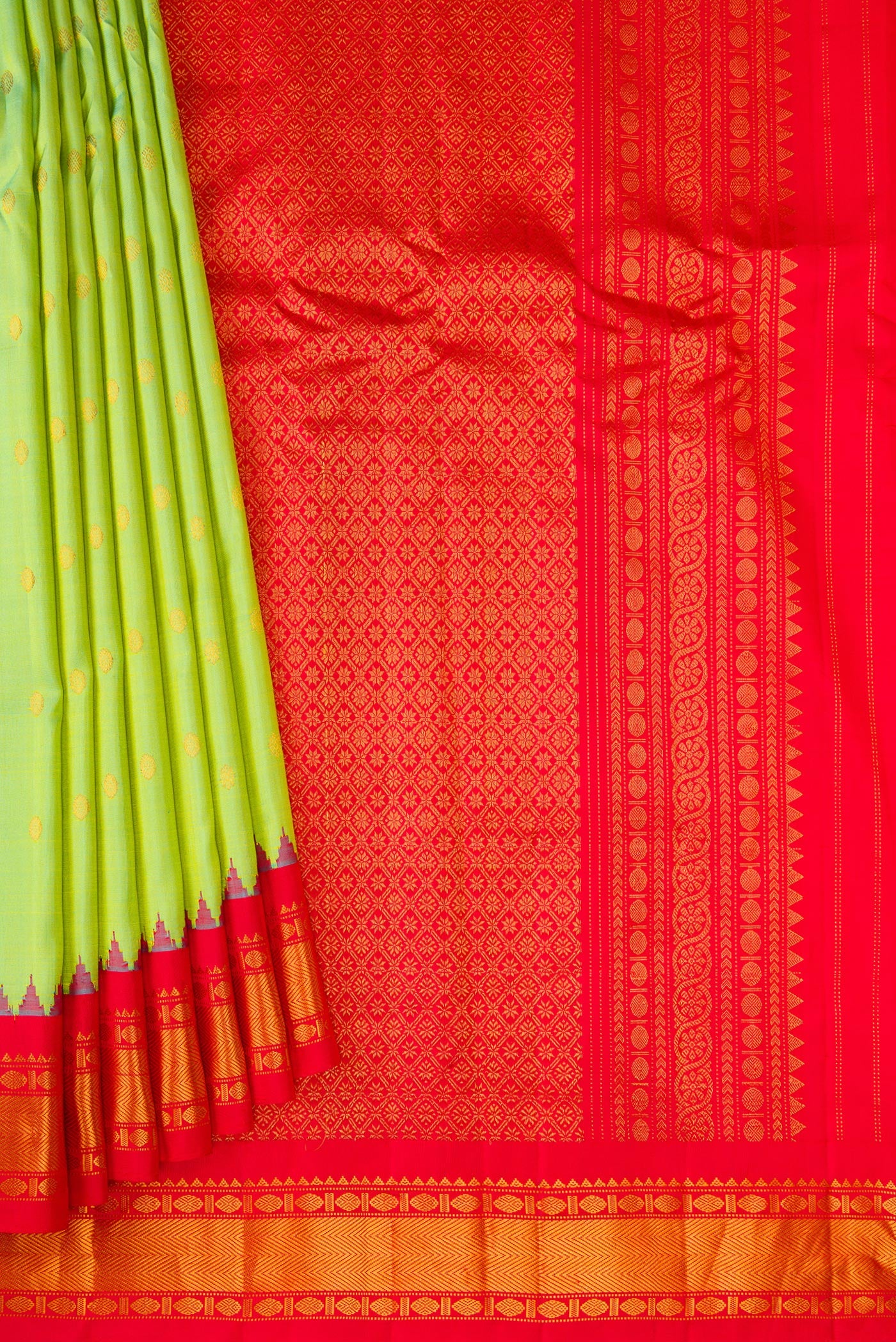 Pleats and pallu of Pista Green Gadwal Silk Saree with Zari Butta on the body and Zari Border. 
