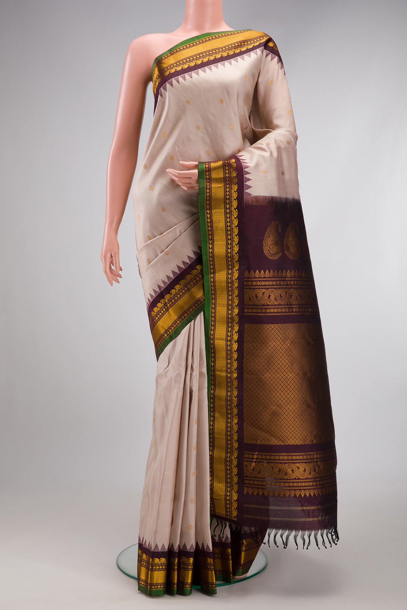 Dark Beige Gadwal Silk Saree with Zari Butta on the body and Zari Border.  displayed on a mannequin