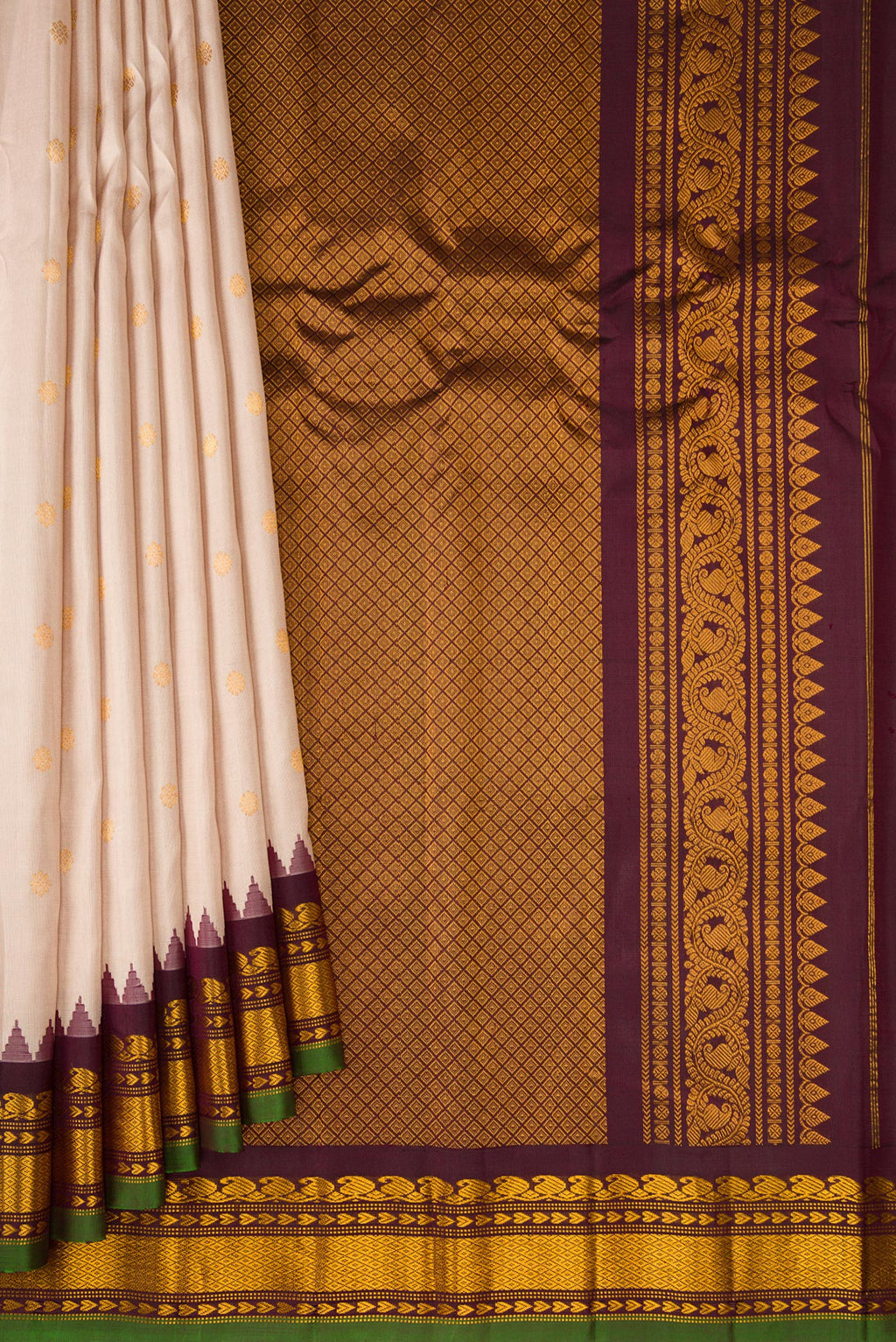 Pleats and pallu of Dark Beige Gadwal Silk Saree with Zari Butta on the body and Zari Border. 