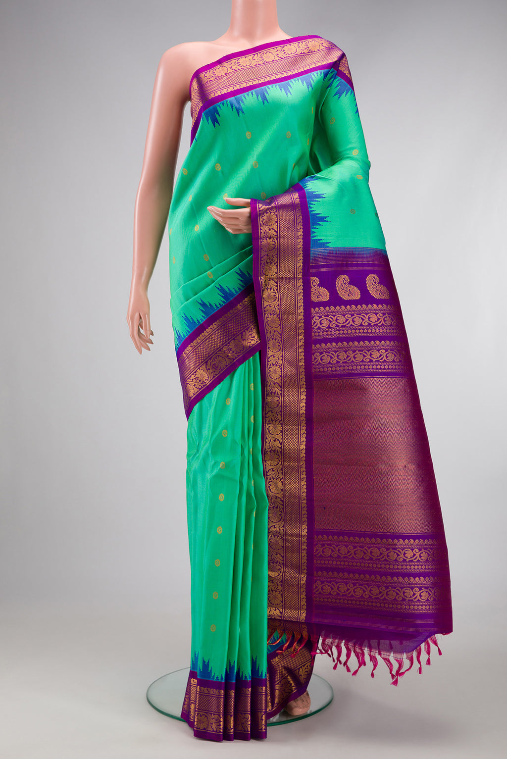 Sea Green Gadwal Silk Saree with Zari Butta on the body and Zari Border.  displayed on a mannequin
