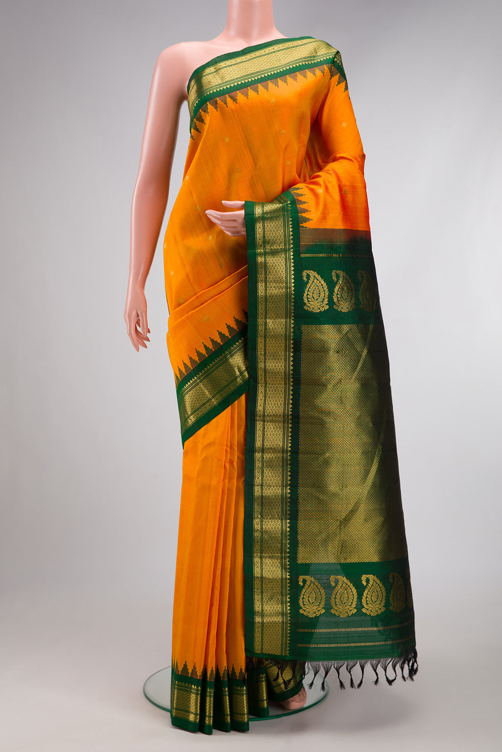 Mustard Dual Tone Gadwal Silk Saree with Zari Butta on the body and Zari Border.  displayed on a mannequin
