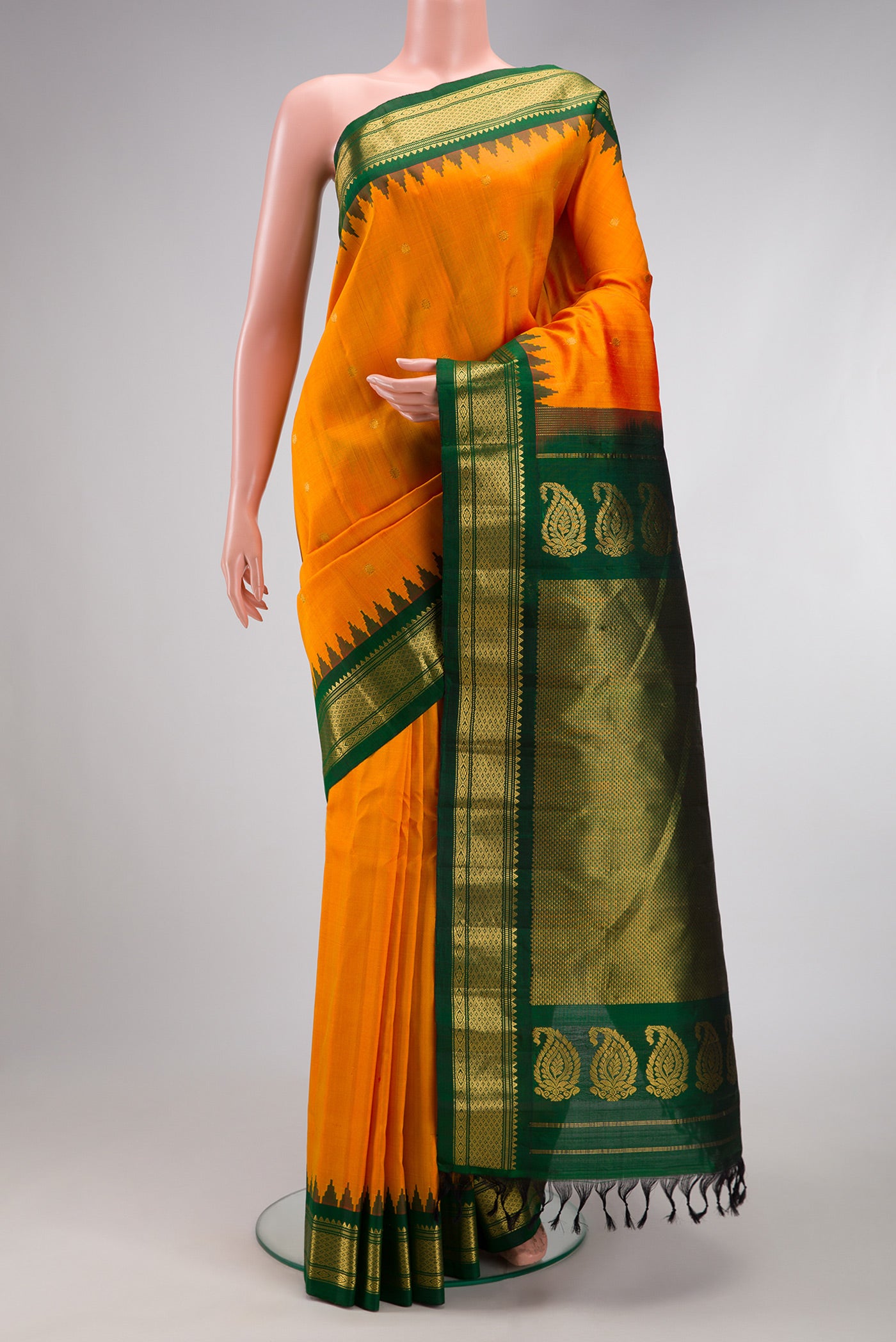 Mustard Dual Tone Gadwal Silk Saree with Zari Butta on the body and Zari Border.  displayed on a mannequin