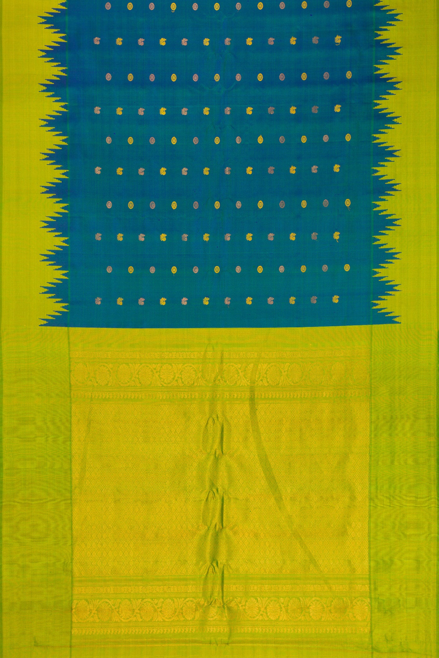 Flat view of Peacock Blue Gadwal Silk Saree with Zari Butta on the body and Temple Border. 
