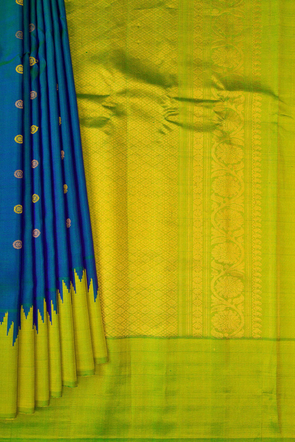 Pleats and pallu of Peacock Blue Gadwal Silk Saree with Zari Butta on the body and Temple Border. 