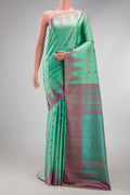 Sea Green Gadwal Silk Saree with Thread Butta on the body and Temple Border.  displayed on a mannequin
