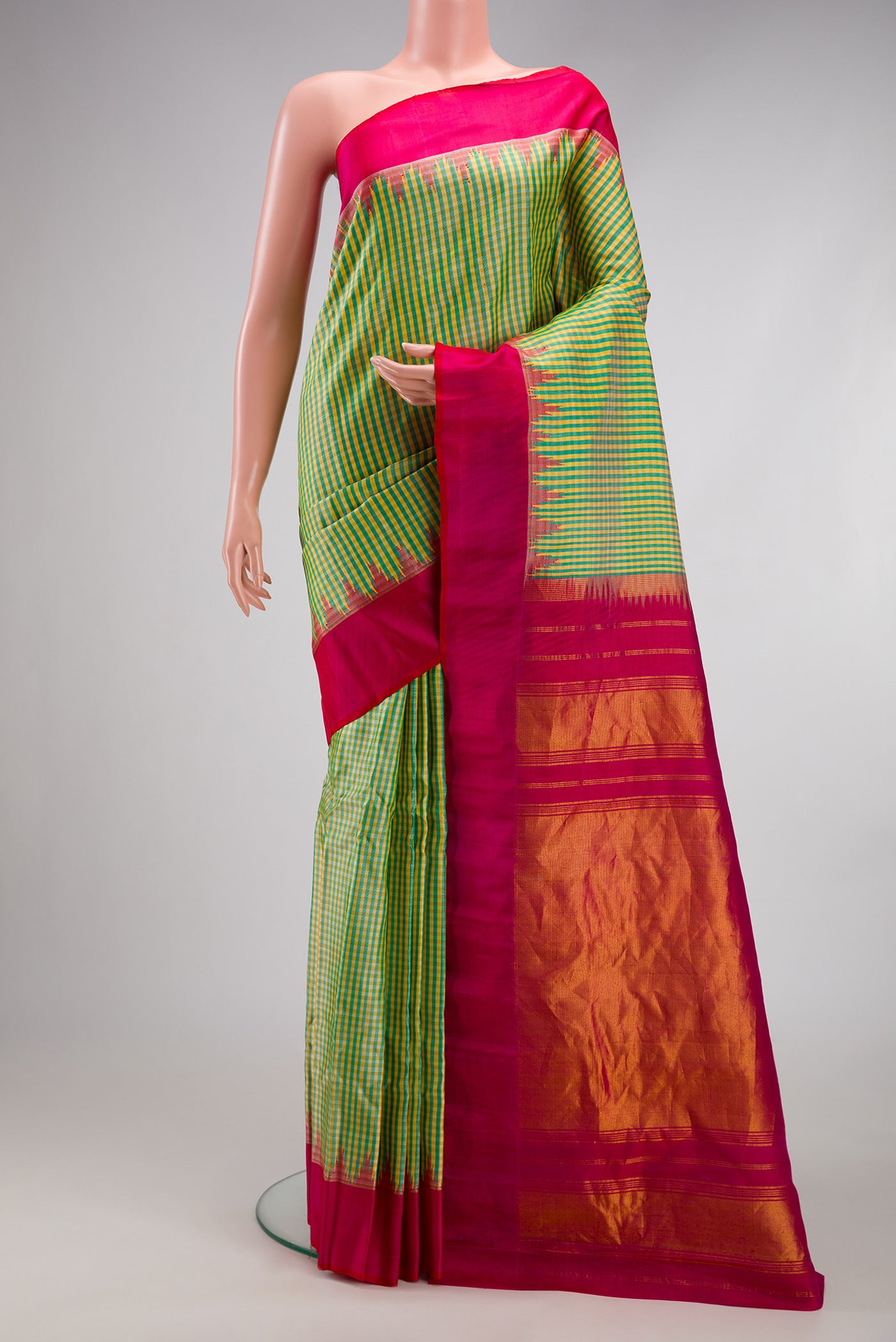 Multi Color Gadwal Silk Saree with Checked design on the body and Temple Border.  displayed on a mannequin