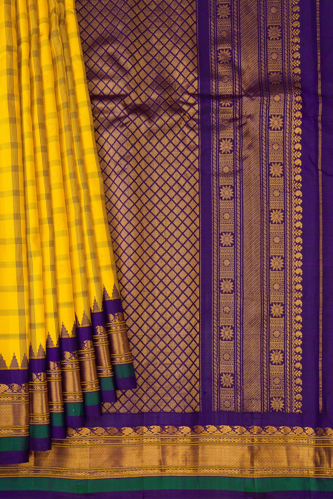 Pleats and pallu of Yellow Gadwal Silk Saree with Checked design on the body and Zari Border. 