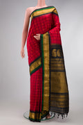 Red Gadwal Silk Saree with Checked design on the body and Zari Border.  displayed on a mannequin