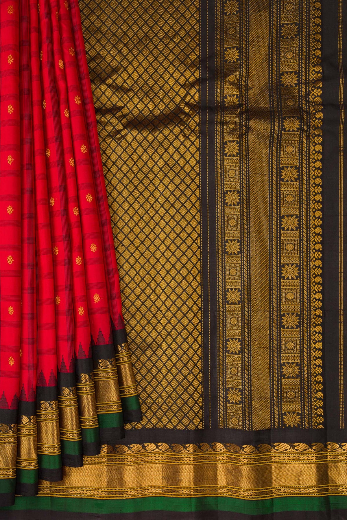 Pleats and pallu of Red Gadwal Silk Saree with Checked design on the body and Zari Border. 