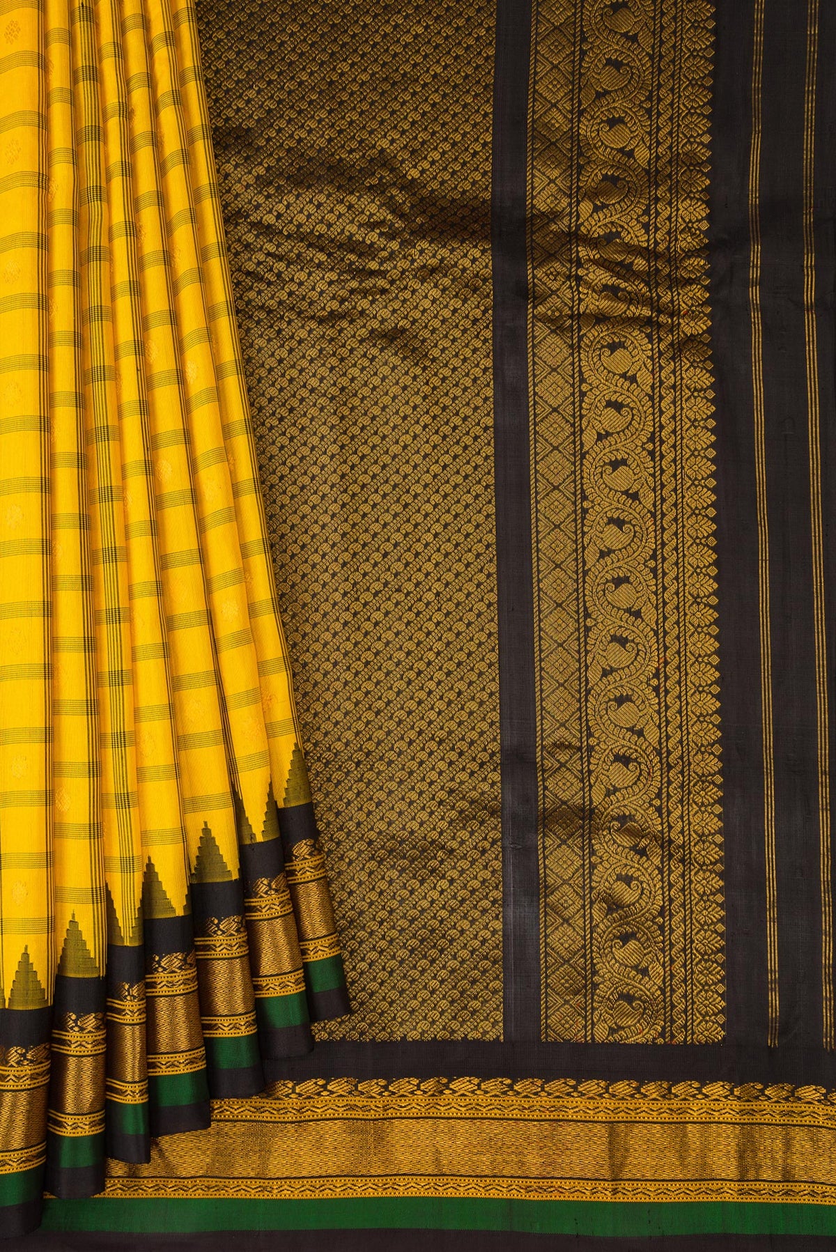 Pleats and pallu of Yellow Gadwal Silk Saree with Checked design on the body and Zari Border. 