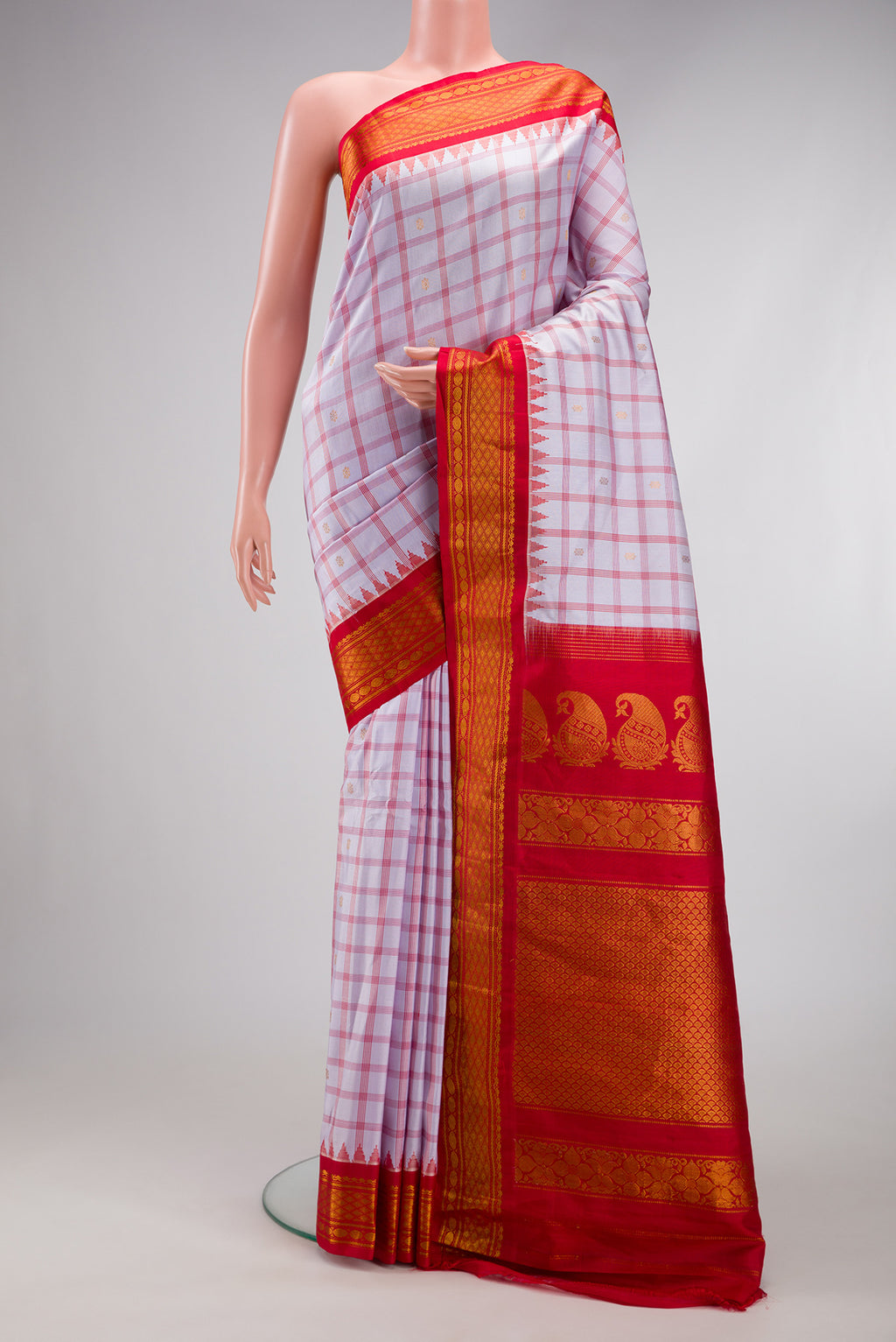 Lilac Gadwal Silk Saree with Checked design on the body and Zari Border.  displayed on a mannequin