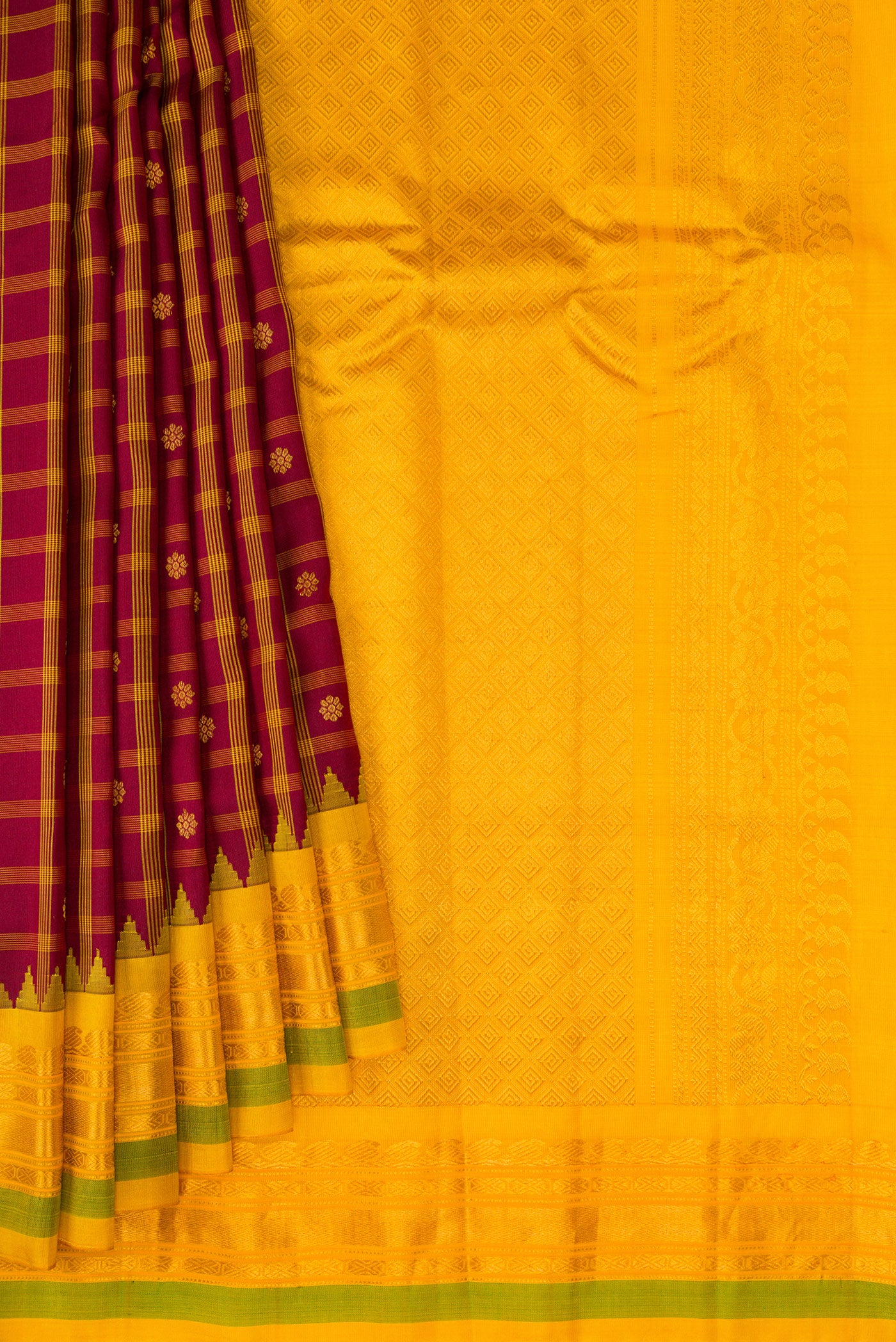 Pleats and pallu of Maroon Gadwal Silk Saree with Checked design on the body and Zari Border. 