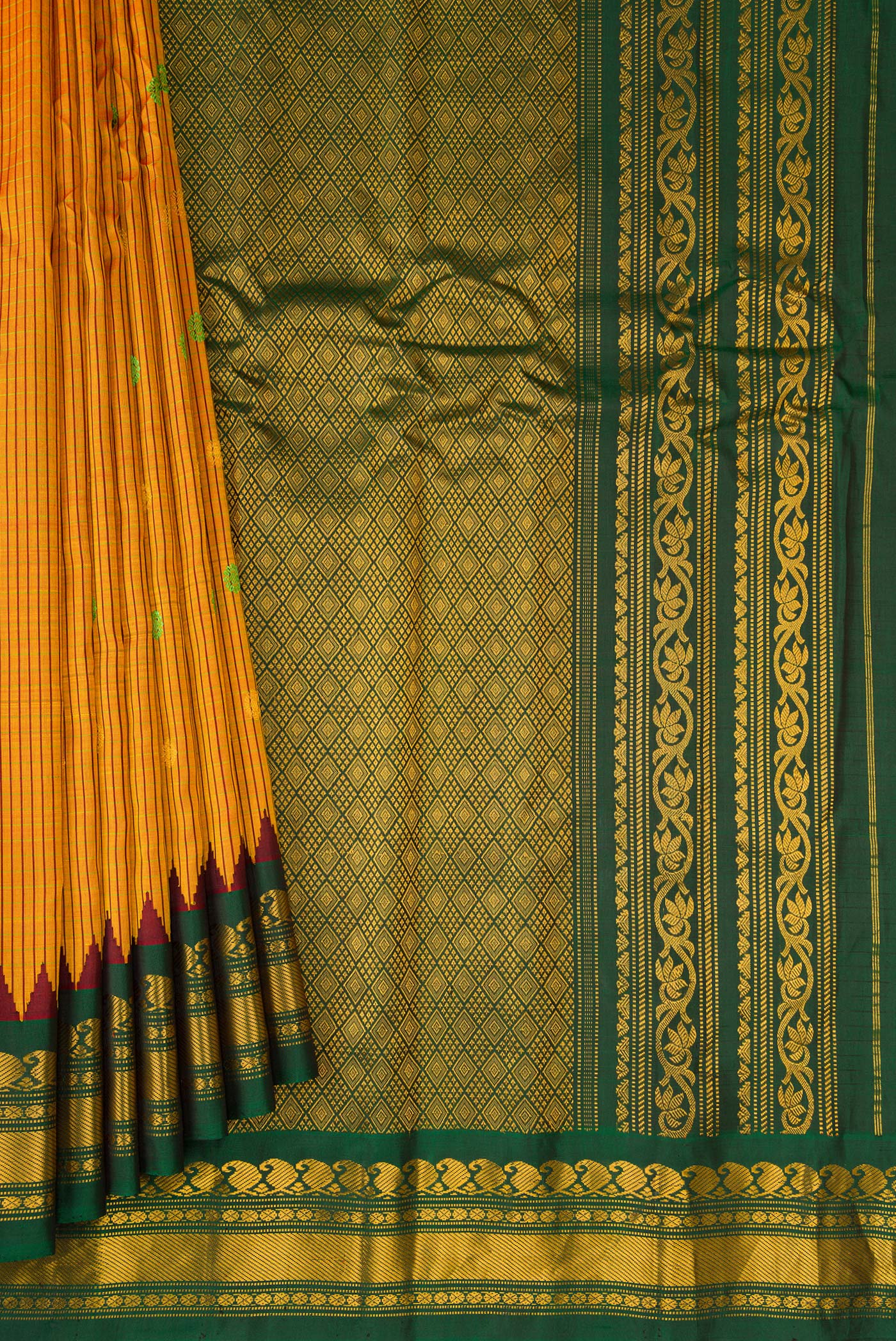 Pleats and pallu of Mustard Gadwal Silk Saree with Checked design on the body and Temple Border. 