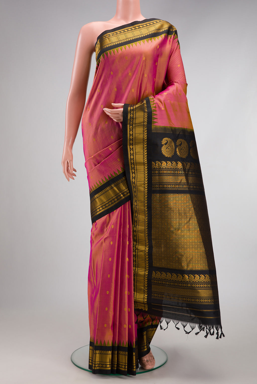 Pink Dual Tone Gadwal Silk Saree with Checked design on the body and Temple Border.  displayed on a mannequin