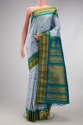 Maya Blue Gadwal Silk Saree with Checked design on the body and Temple Border.  displayed on a mannequin