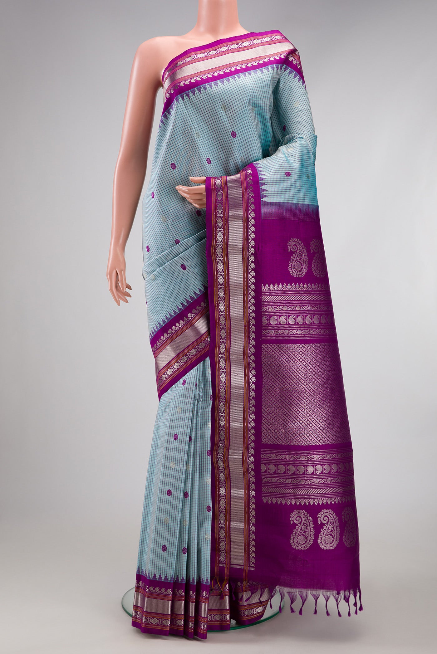 Sky Blue Gadwal Silk Saree with Checked design on the body and Temple Border.  displayed on a mannequin