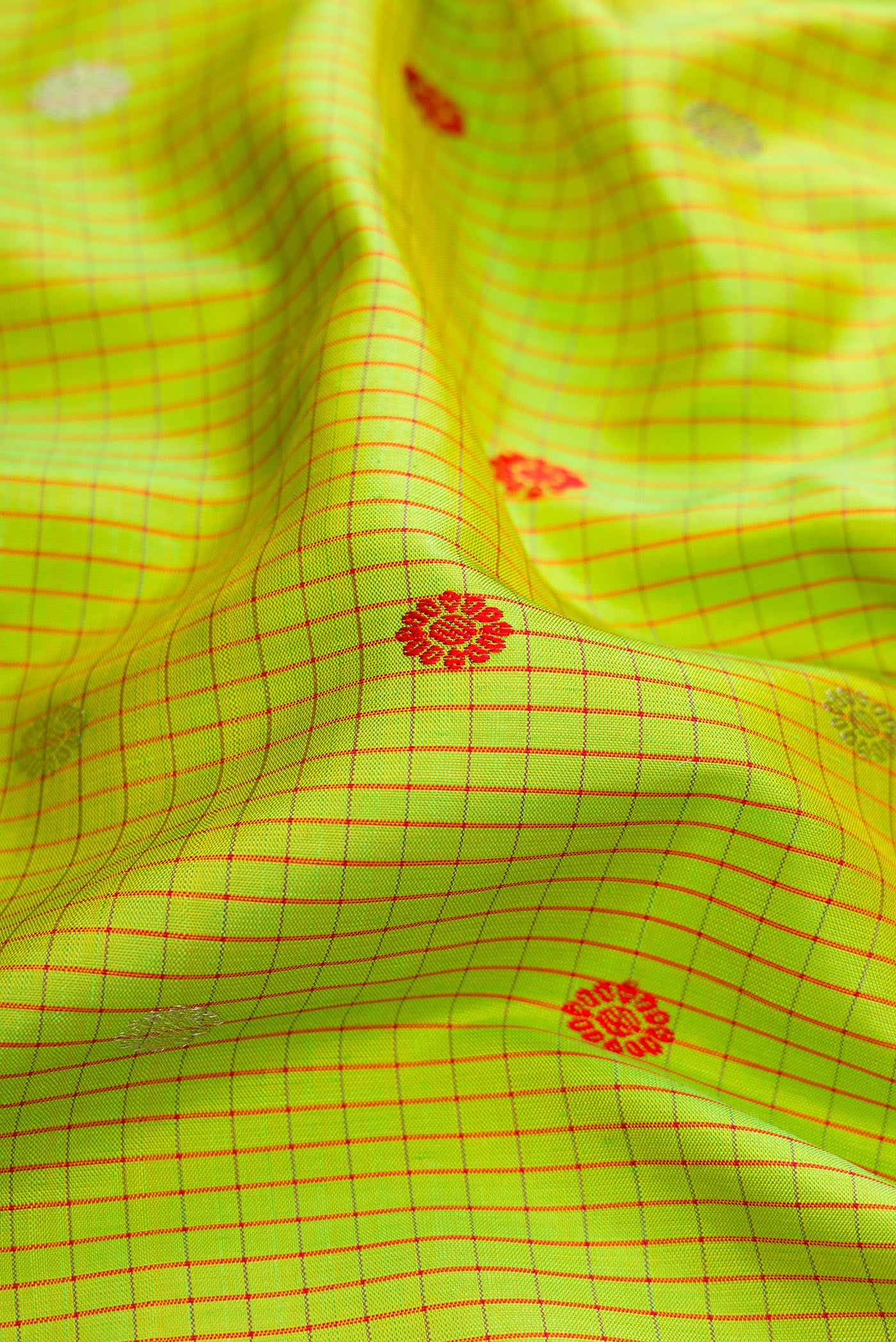 Close up of Parrot Green Gadwal Silk Saree with Checked design on the body and Temple Border.  displaying folds