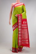 Parrot Green Gadwal Silk Saree with Checked design on the body and Temple Border.  displayed on a mannequin