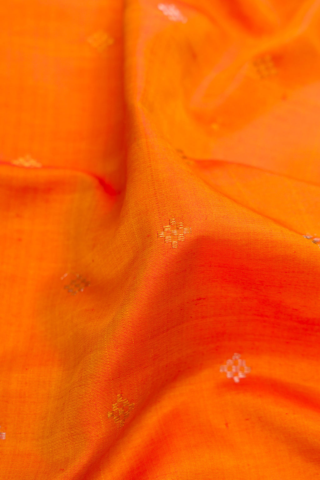 Close up of Mustard Gadwal Silk Saree with Zari Butta on the body and Fancy Border.  displaying folds