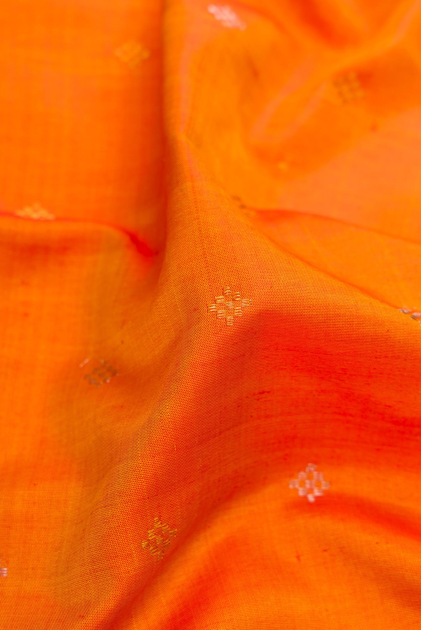 Close up of Mustard Gadwal Silk Saree with Zari Butta on the body and Fancy Border.  displaying folds