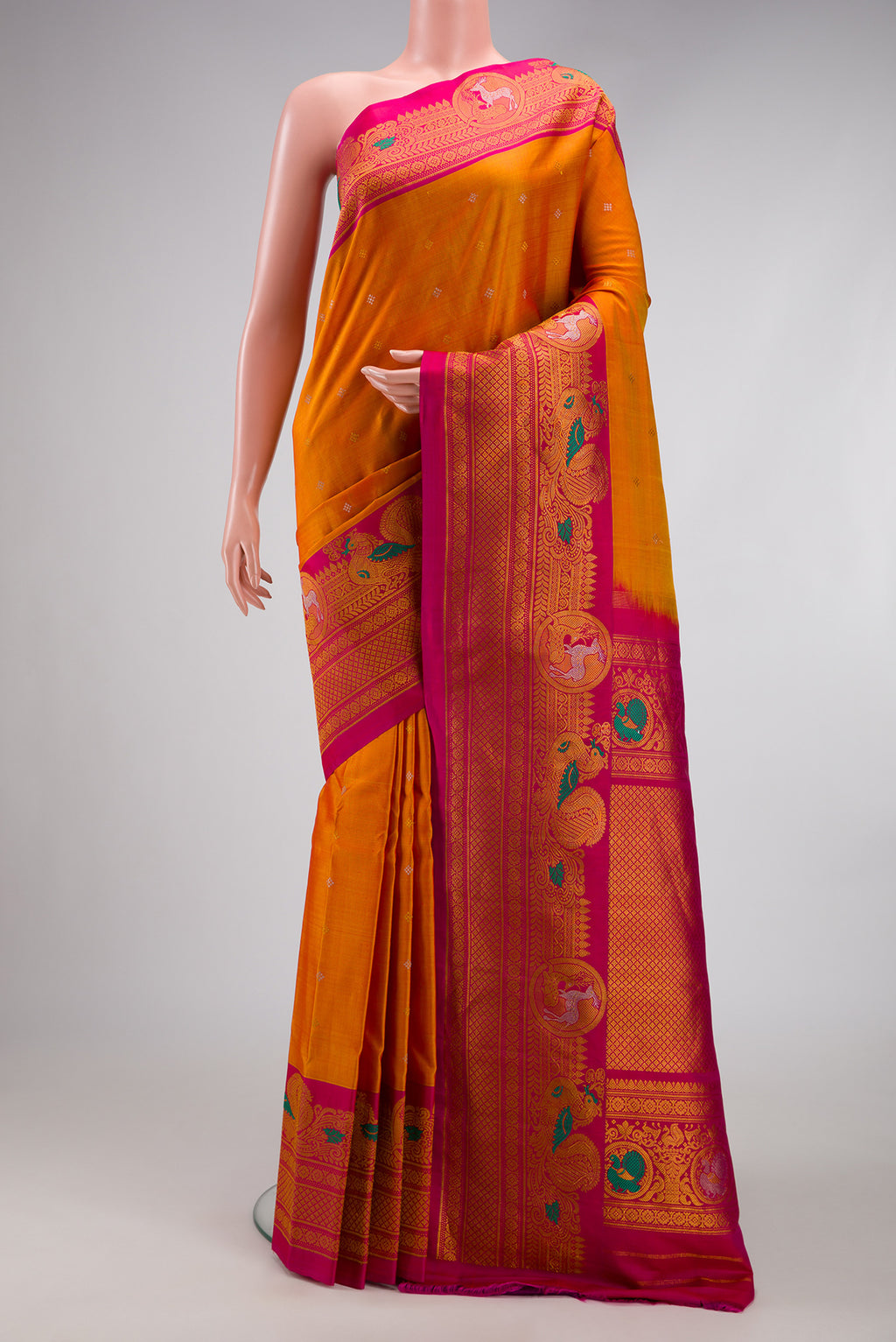 Mustard Gadwal Silk Saree with Zari Butta on the body and Fancy Border.  displayed on a mannequin