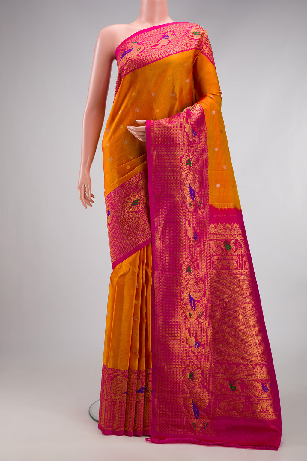 Mustard Dual Tone Gadwal Silk Saree with Zari Butta on the body and Fancy Border.  displayed on a mannequin