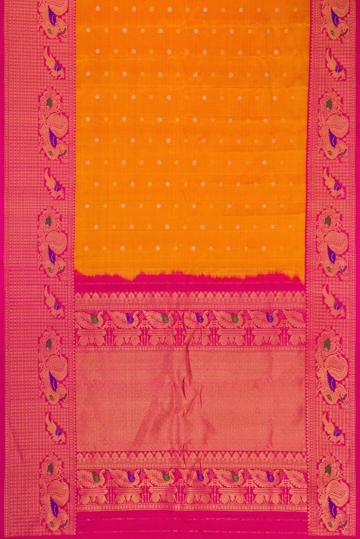 Flat view of Mustard Dual Tone Gadwal Silk Saree with Zari Butta on the body and Fancy Border. 