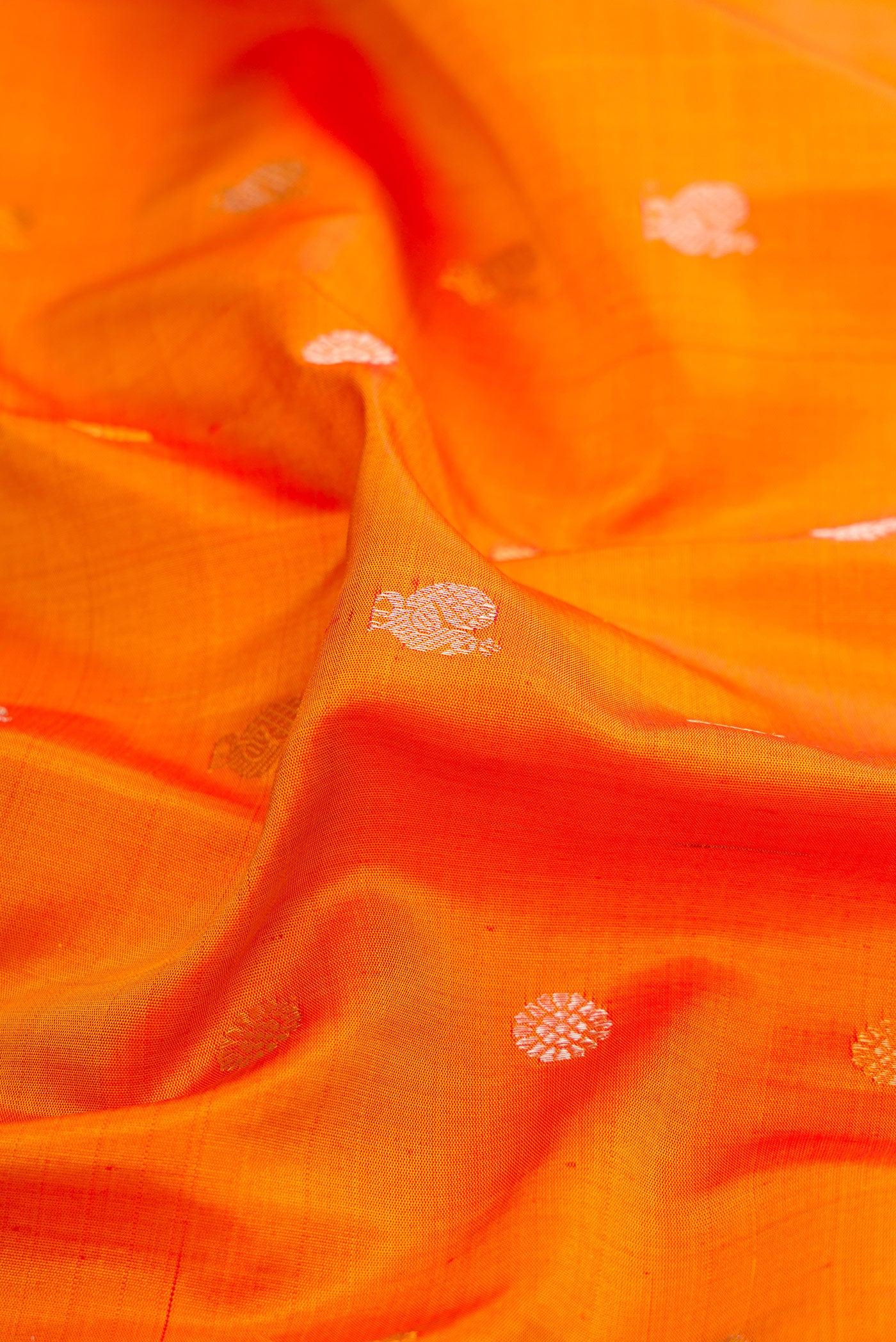 Close up of Mustard Gadwal Silk Saree with Zari Butta on the body and Fancy Border.  displaying folds
