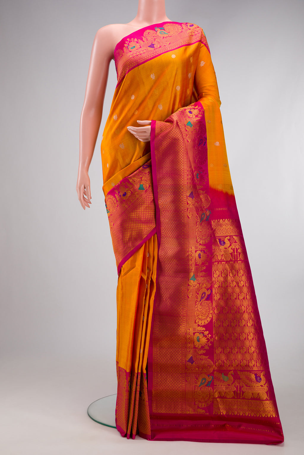 Mustard Gadwal Silk Saree with Zari Butta on the body and Fancy Border.  displayed on a mannequin