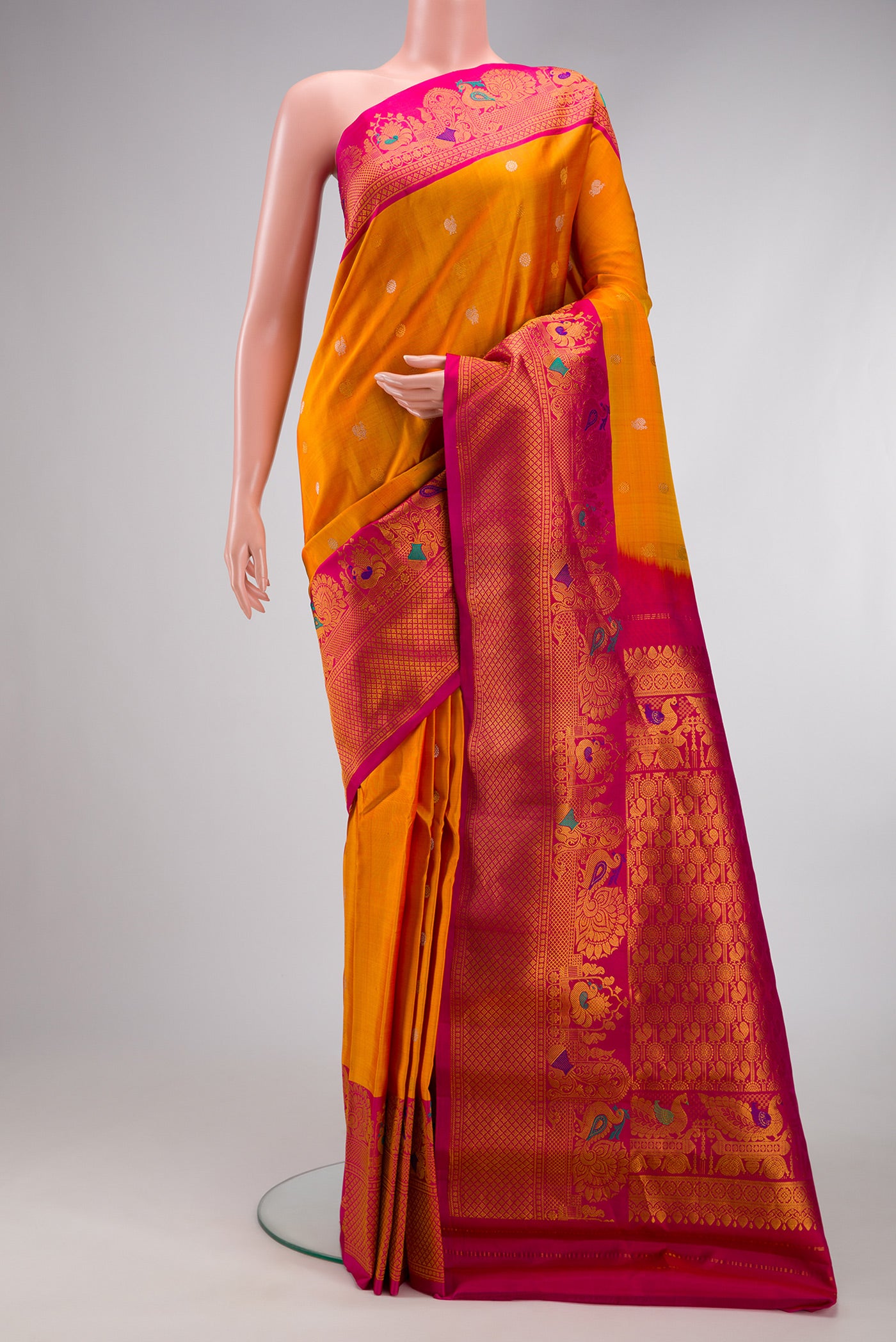 Mustard Gadwal Silk Saree with Zari Butta on the body and Fancy Border.  displayed on a mannequin