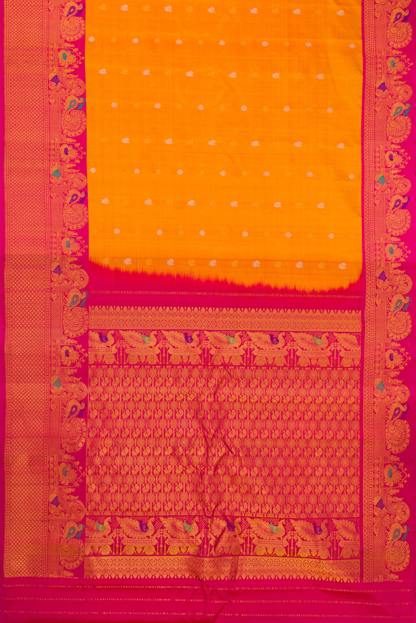 Flat view of Mustard Gadwal Silk Saree with Zari Butta on the body and Fancy Border. 
