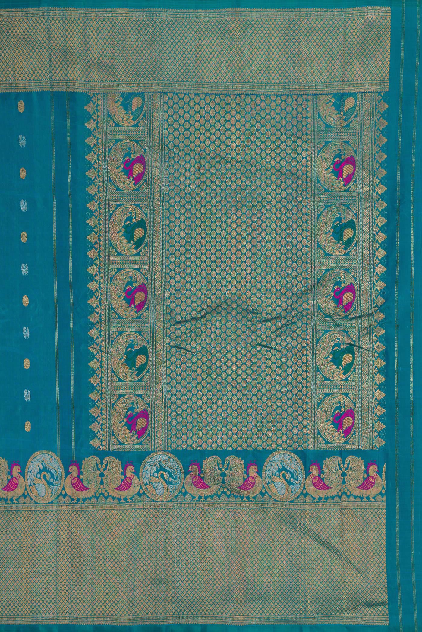 Close up image of the pallu of Peacock Blue Gadwal Silk Saree with Zari Butta on the body and Fancy Border. 