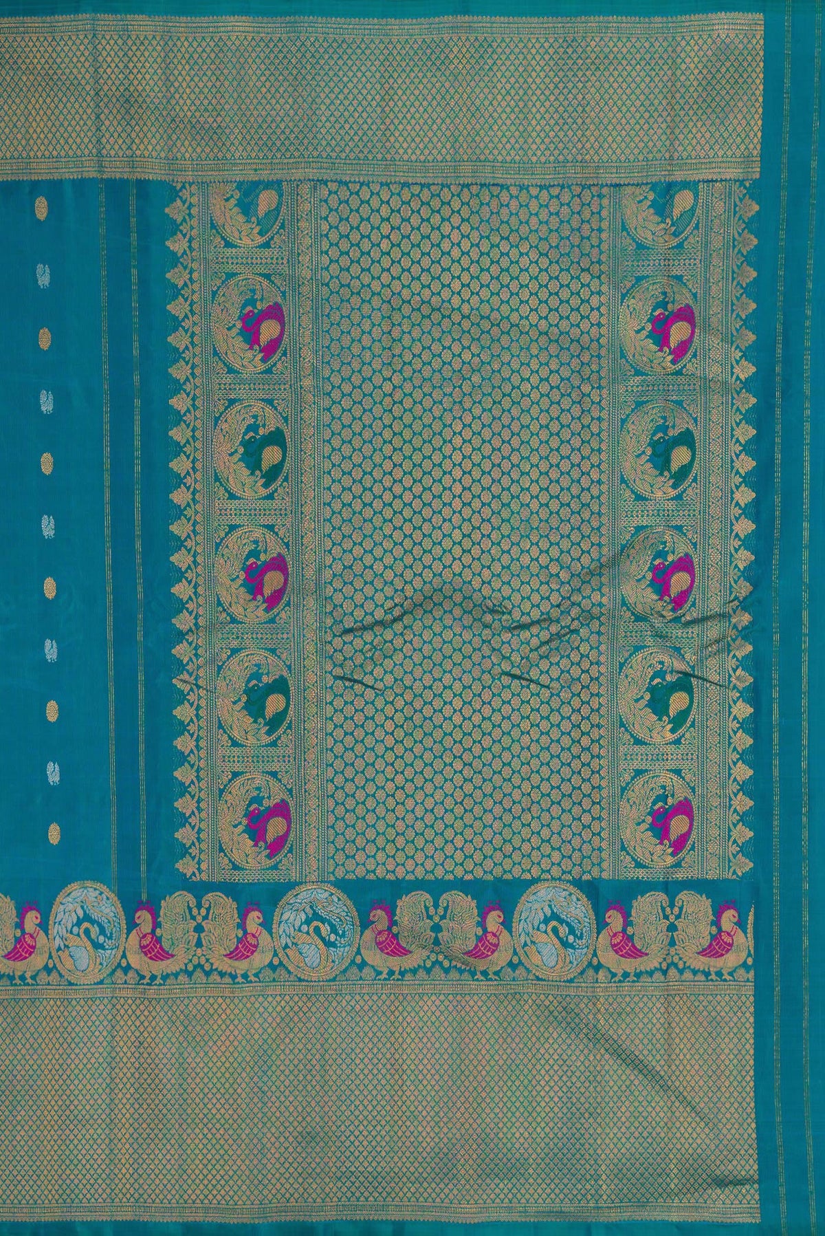 Close up image of the pallu of Peacock Blue Gadwal Silk Saree with Zari Butta on the body and Fancy Border. 
