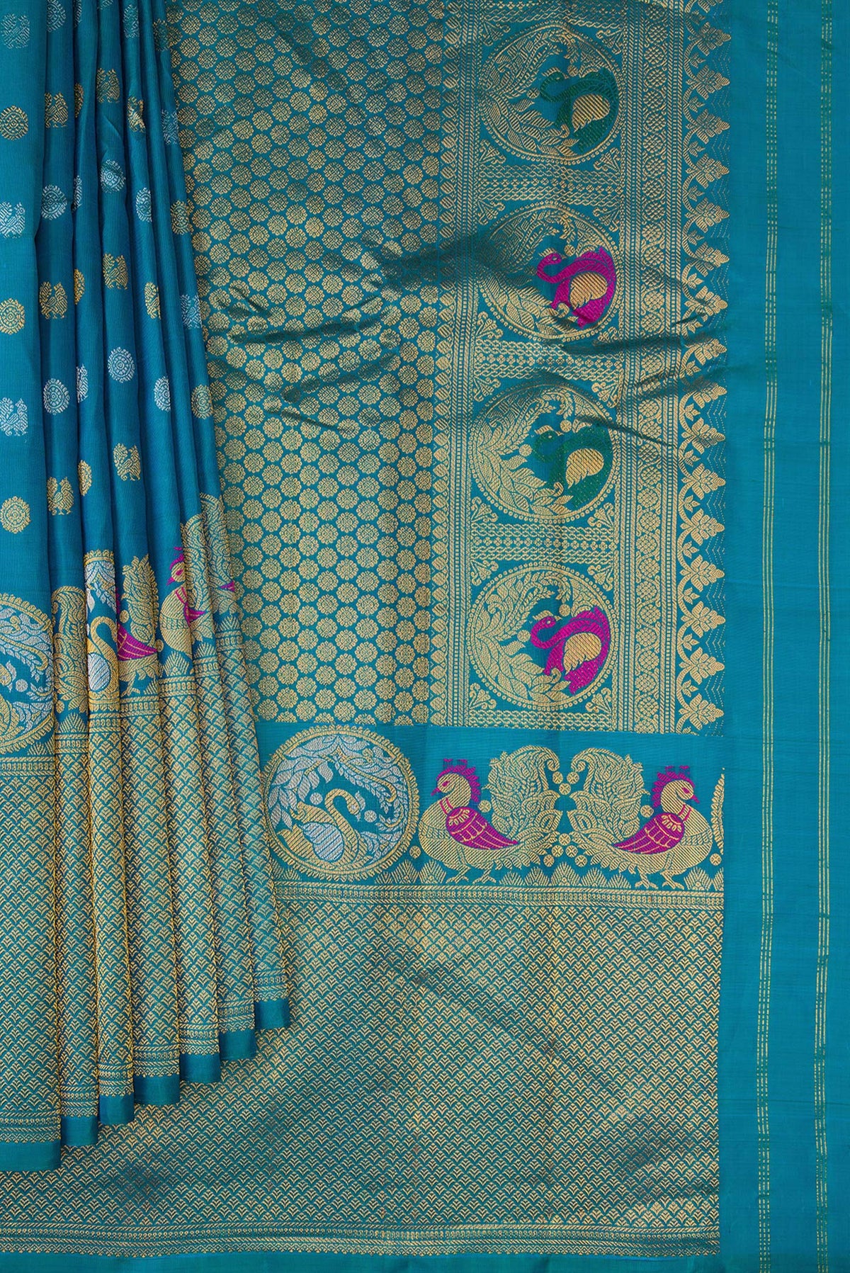 Pleats and pallu of Peacock Blue Gadwal Silk Saree with Zari Butta on the body and Fancy Border. 